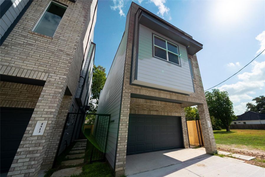 Front exterior of a new home in , Houston, TX, highlighting curb appeal (Image 22).