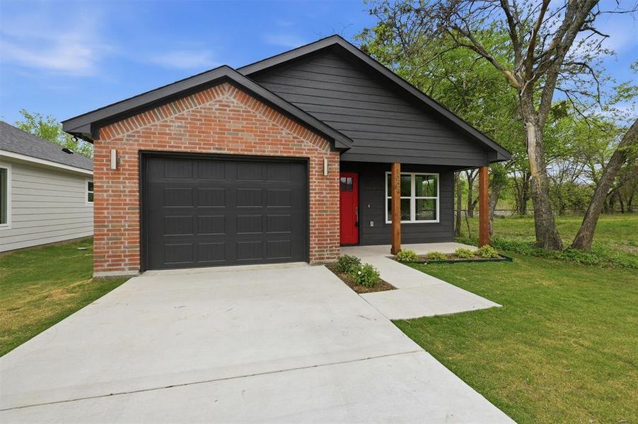 Front exterior of a new home in , Sherman, TX, highlighting curb appeal (Image 16).
