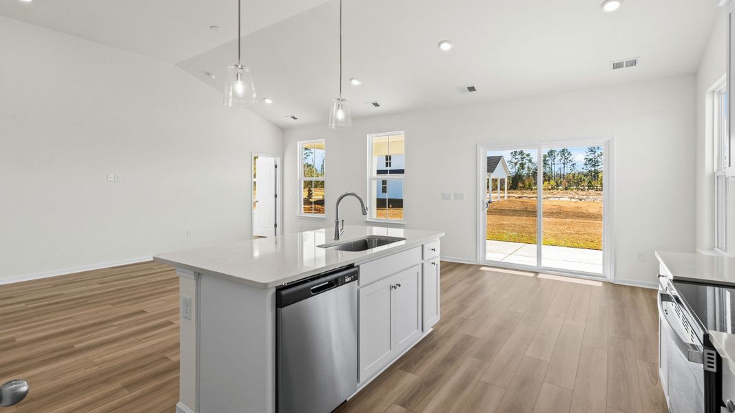A functional and stylish island serves as the heart of the Easton kitchen A functional and stylish island serves as the heart of the Easton kitchen