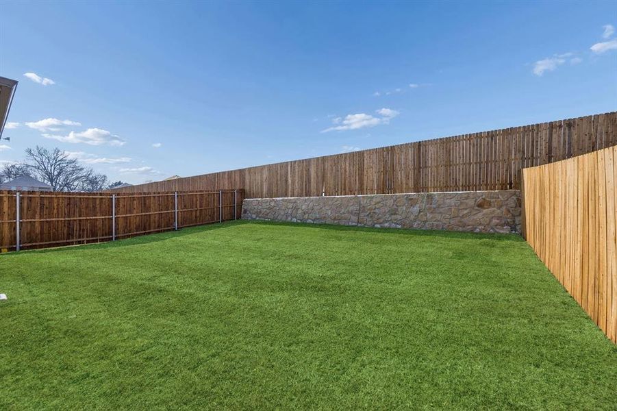 Covered Patio in the Willow home plan by Trophy Signature Homes – REPRESENTATIVE PHOTO