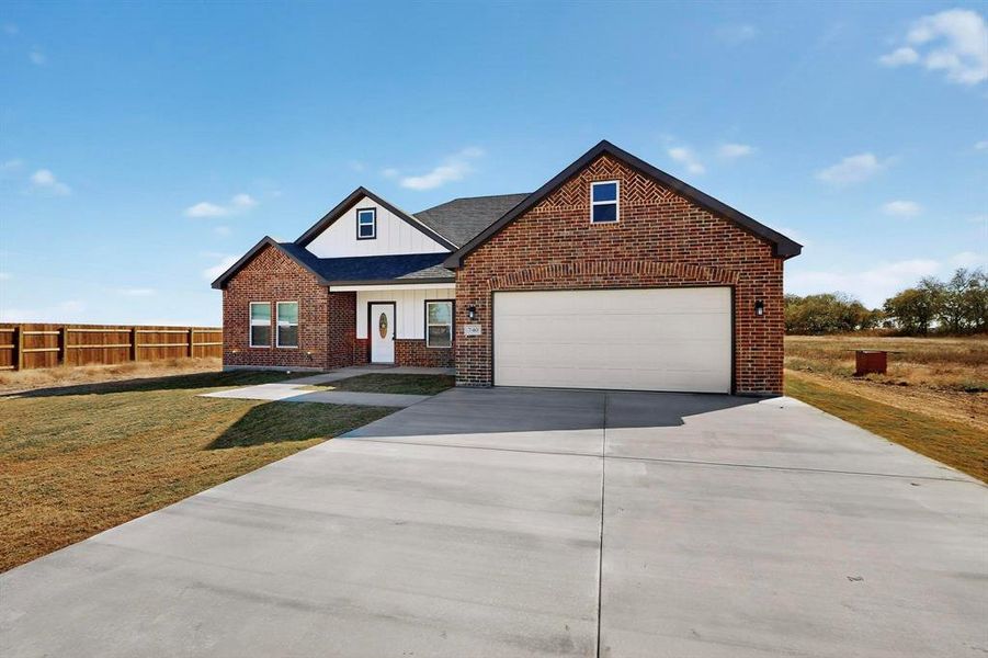 Front exterior of a new home in , Alma, TX, highlighting curb appeal (Image 19).