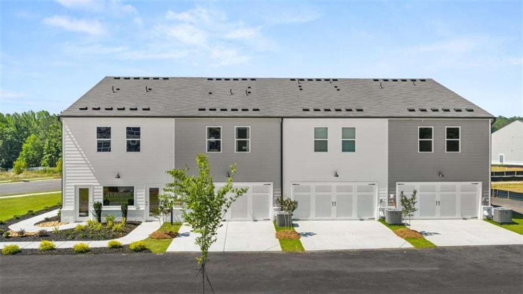 Front exterior of a new home in , Stockbridge, GA, highlighting curb appeal (Image 35).