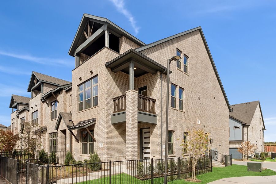 Front exterior of a new home in Hillside at Las Colinas, Irving, TX, highlighting curb appeal (Image 2). Front exterior of a new home in Hillside at Las Colinas, Irving, TX, highlighting curb appeal (Image 2).