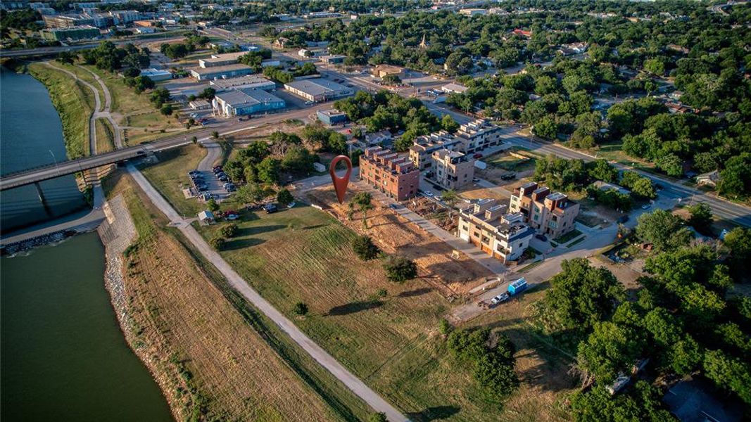 Birds eye view of property with a water view