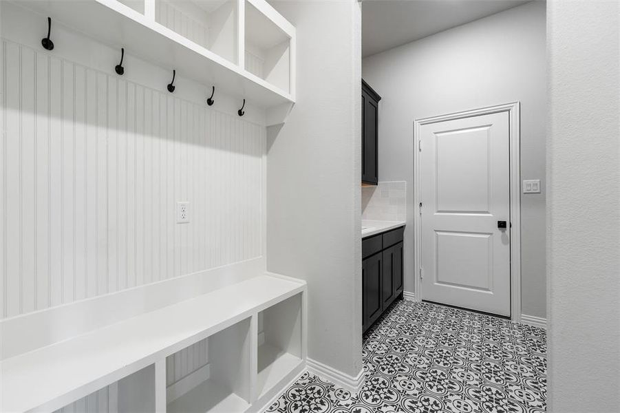 Mudroom featuring baseboards Mudroom featuring baseboards