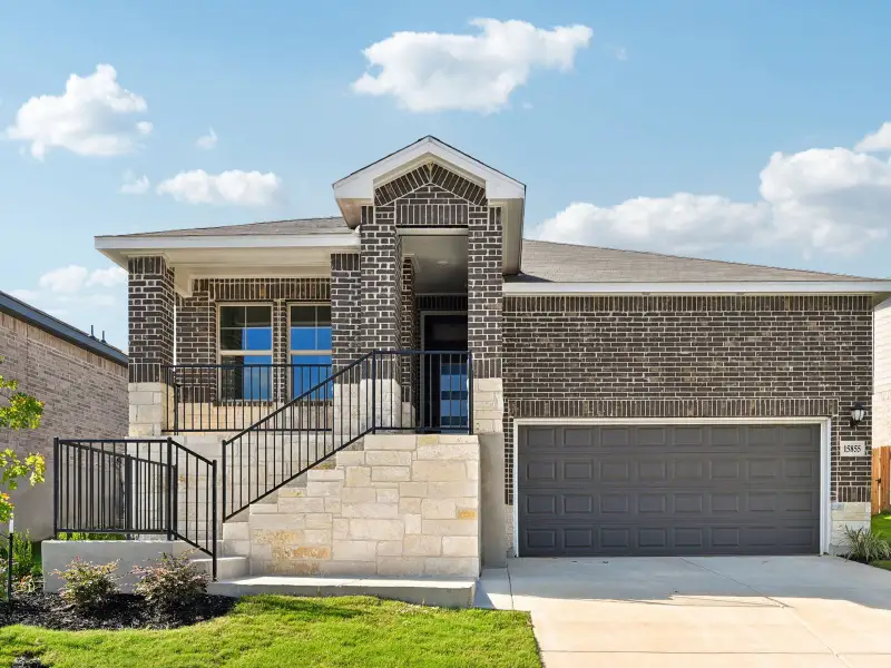 Front exterior of a new home in Comanche Ridge, San Antonio, TX, highlighting curb appeal (Image 1). Front exterior of a new home in Comanche Ridge, San Antonio, TX, highlighting curb appeal (Image 1).