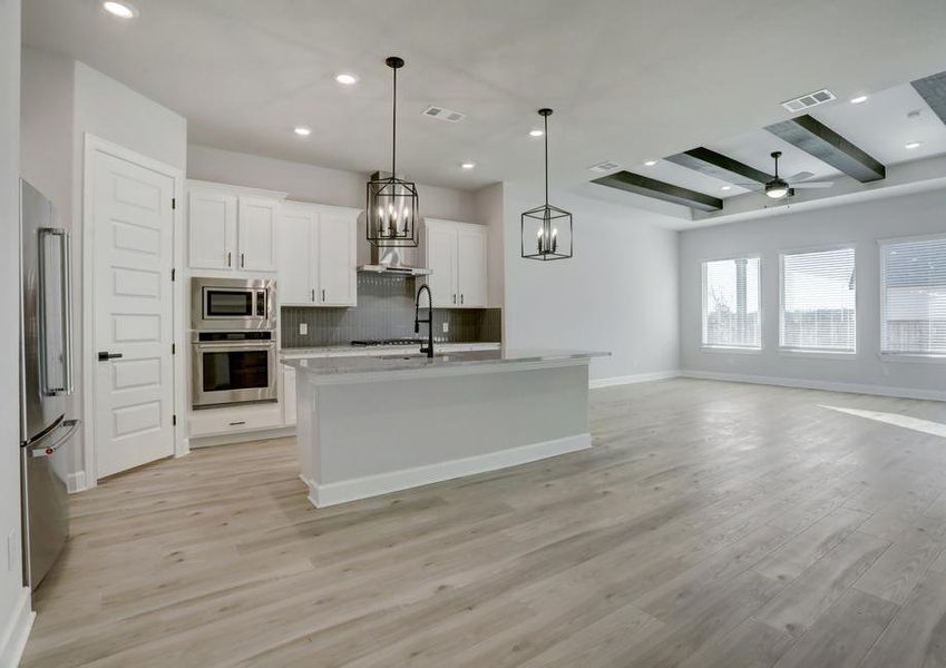 Open layout with the kitchen overlooking the dining area and living room.