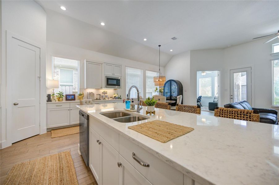 The spacious island overlooks the main living areas. The spacious island overlooks the main living areas.