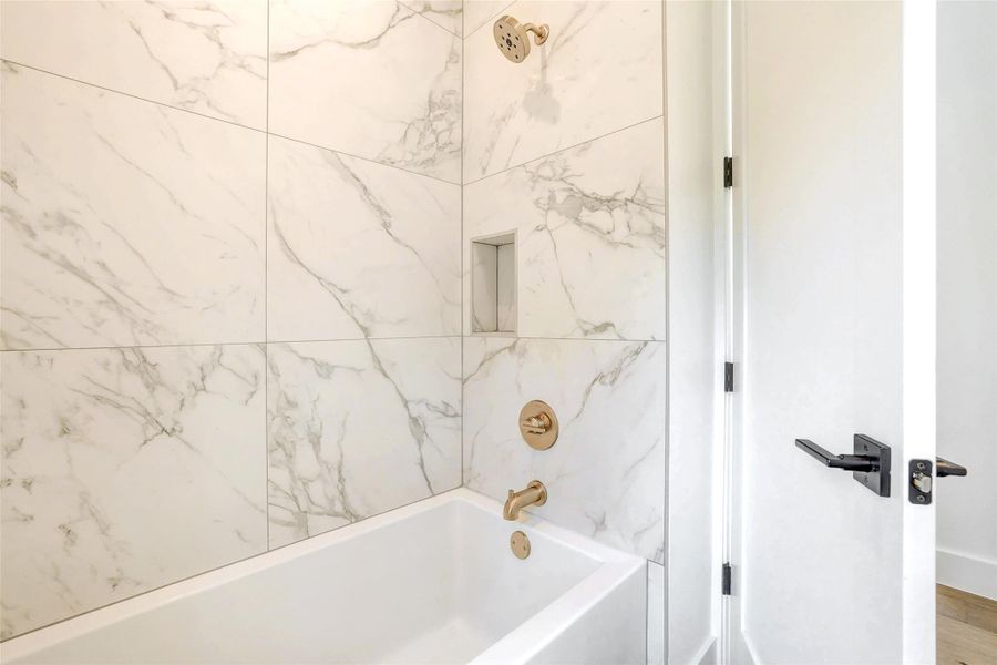 Bathroom with shower / washtub combination