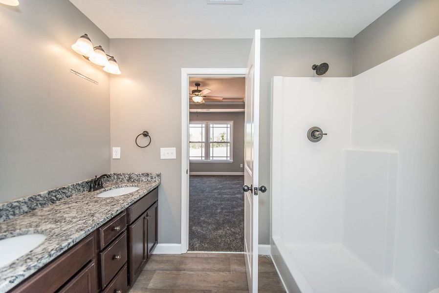 Representative furnished interior of a home built from the Archer by Enchanted Homes in Lonesome Dove, San Antonio (Image 19).