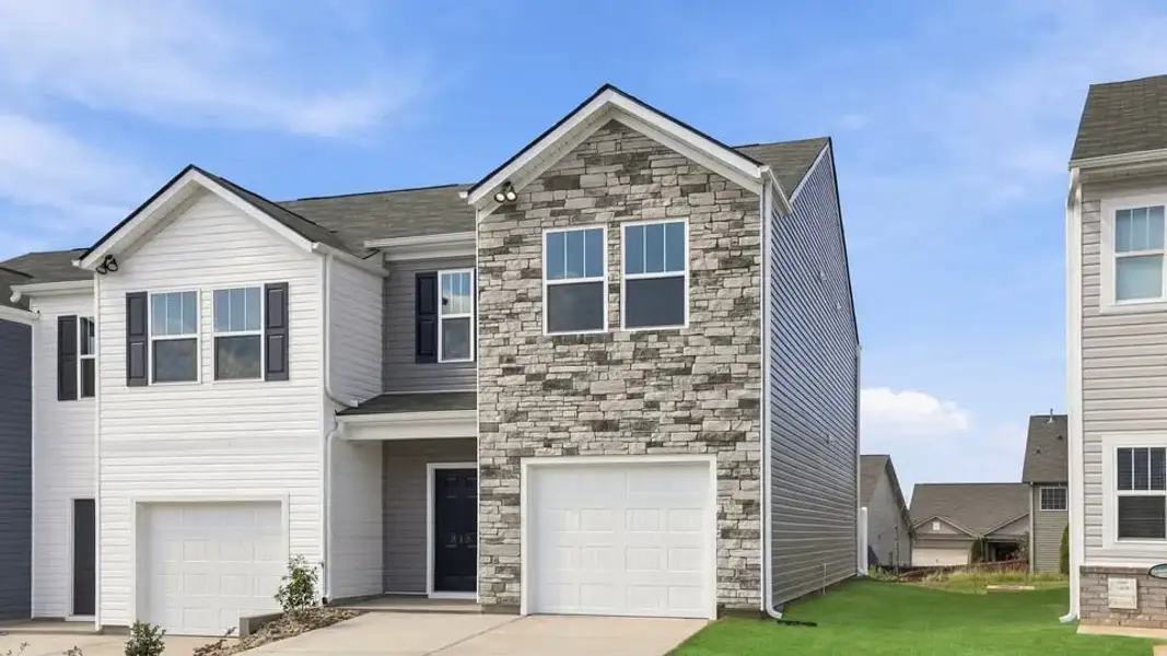 Front exterior of a new home in Covington Village, Greer, SC, highlighting curb appeal (Image 2). Front exterior of a new home in Covington Village, Greer, SC, highlighting curb appeal (Image 2).