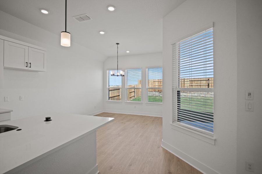 Representative furnished interior of a home built from the Farris by Chesmar Homes in The Grove at Blackhawk, Pflugerville (Image 5).