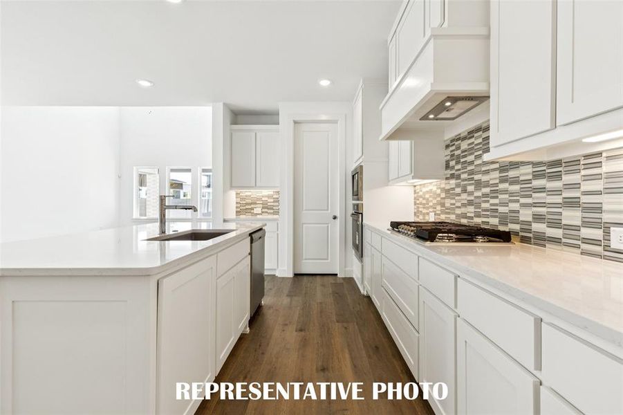 You'll find thoughtful design elements like pull out trash, pot & pan drawers and walk in pantry throughout this chef's dream kitchen!  REPRESENTATIVE PHOTO