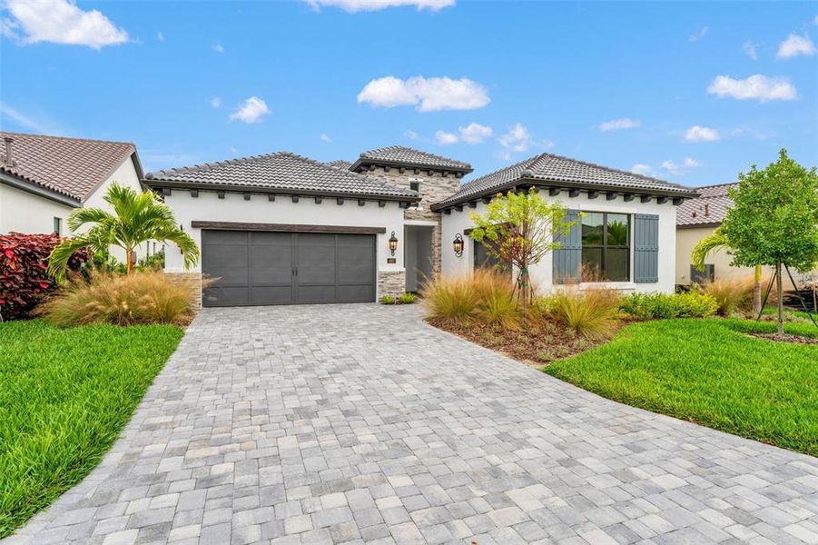 Front exterior of a new home in , Nokomis, FL, highlighting curb appeal (Image 26). Front exterior of a new home in , Nokomis, FL, highlighting curb appeal (Image 26).