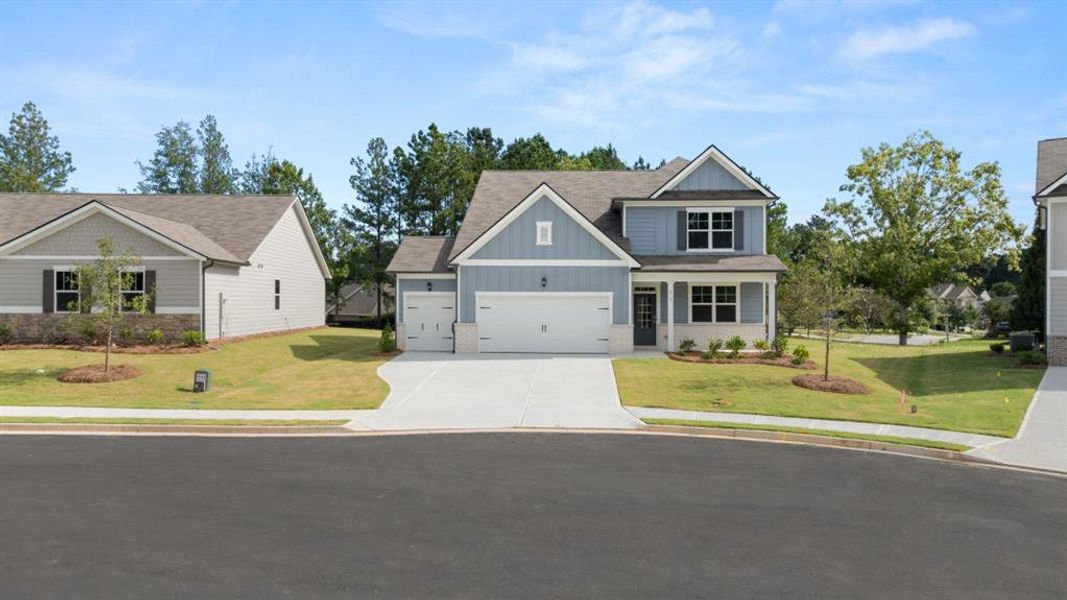 Front exterior of a new home in Fairway 17 at Mirror Lake, Villa Rica, GA, highlighting curb appeal (Image 18).