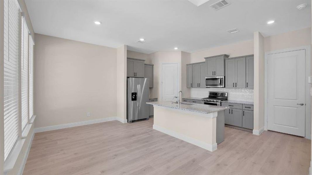 Furnished interior view inside a new home in Mustang Square, Plano (Image 5). Furnished interior view inside a new home in Mustang Square, Plano (Image 5).