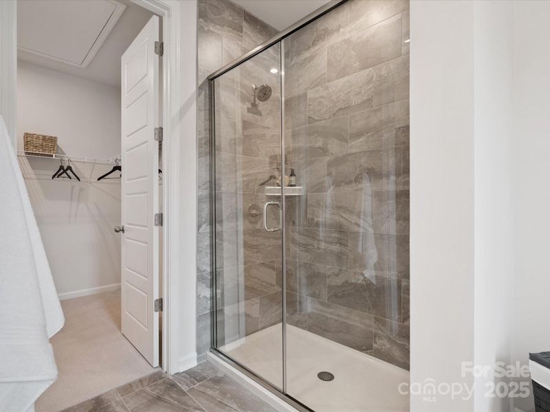Primary Walk-In Shower with Modern Tile Design Primary Walk-In Shower with Modern Tile Design