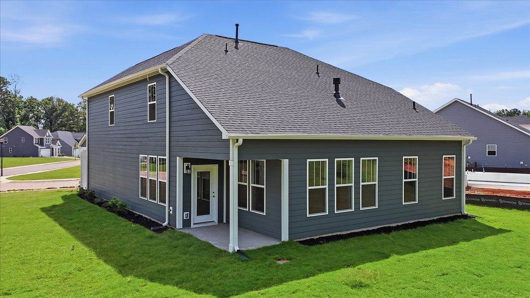 Vibrant rear outdoor space featuring a covered porch and exceptional craftsmanship in Anderson, SC