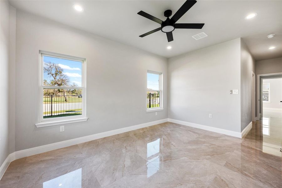 Unfurnished room with light marble finish flooring, ceiling fan, and recessed lighting