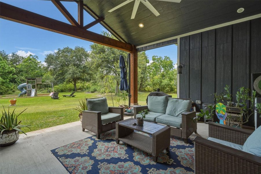 Beautiful covered back patio with large fan to beat the Texas Heat! Overlooking 2 acres of land! Beautiful covered back patio with large fan to beat the Texas Heat! Overlooking 2 acres of land!