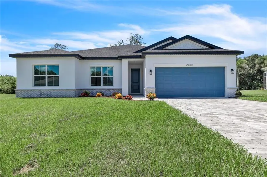 Front exterior of a new home in , Punta Gorda, FL, highlighting curb appeal (Image 26).