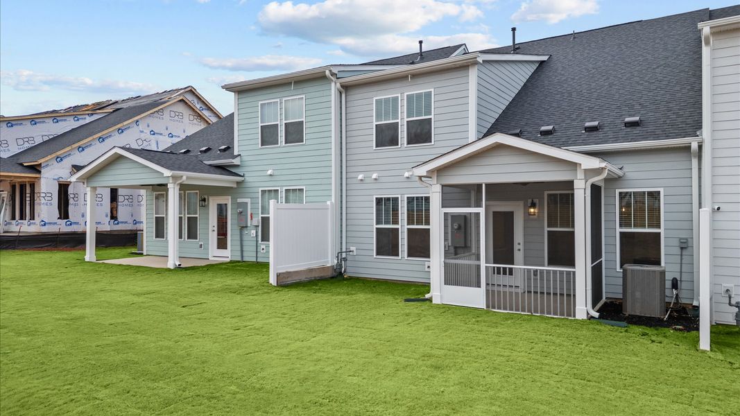 Accomplished exterior with a spacious rear screened porch that blends comfort and style