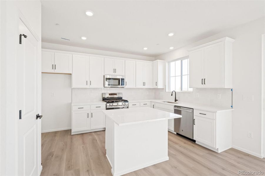 Furnished interior view inside a new home in The Nest Classic at Canyon Creek, Erie (Image 14).