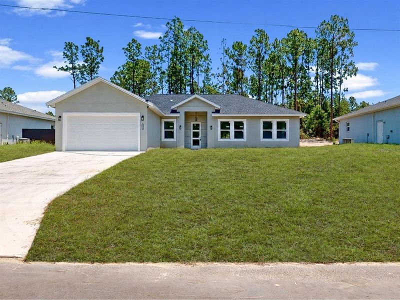 Front exterior of a new home in , Ocala, FL, highlighting curb appeal (Image 21). Front exterior of a new home in , Ocala, FL, highlighting curb appeal (Image 21).