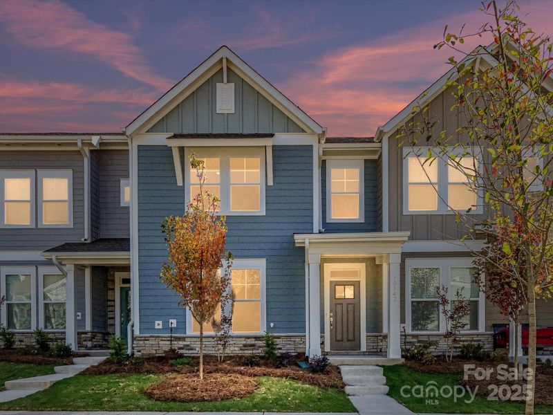 Front exterior of a new home in North Creek Village, Huntersville, NC, highlighting curb appeal (Image 2). Front exterior of a new home in North Creek Village, Huntersville, NC, highlighting curb appeal (Image 2).