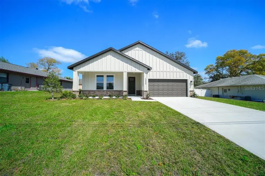 Front exterior of a new home in , Spring Hill, FL, highlighting curb appeal (Image 2). Front exterior of a new home in , Spring Hill, FL, highlighting curb appeal (Image 2).