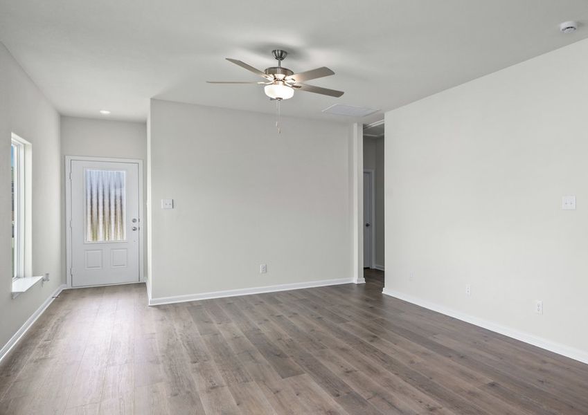 The spacious living room has space for large furniture, so everyone has a seat.