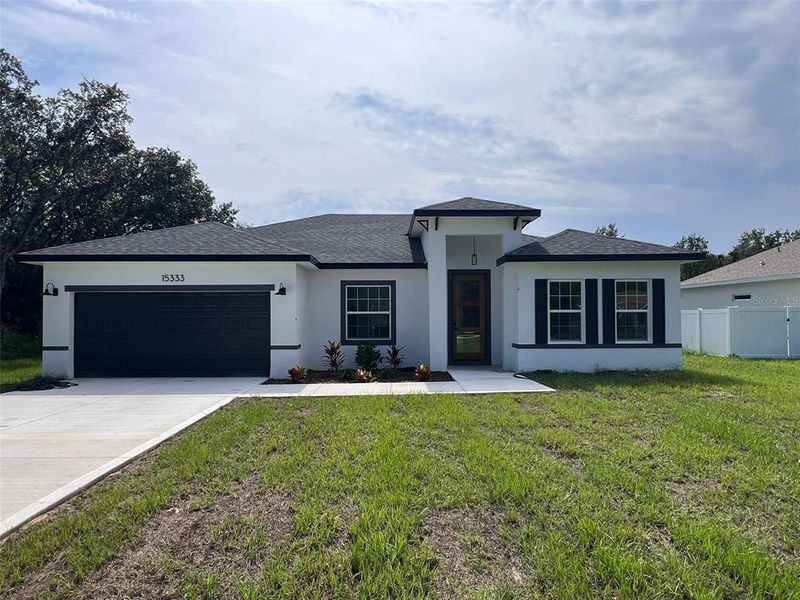 Front exterior of a new home in , Ocala, FL, highlighting curb appeal (Image 1). Front exterior of a new home in , Ocala, FL, highlighting curb appeal (Image 1).