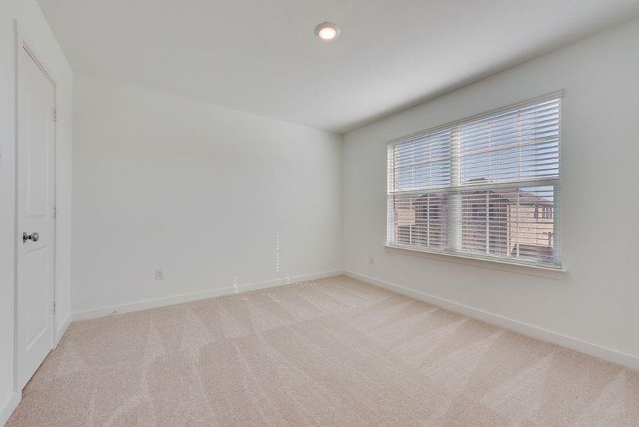 Unfurnished room featuring light carpet and recessed lighting Unfurnished room featuring light carpet and recessed lighting