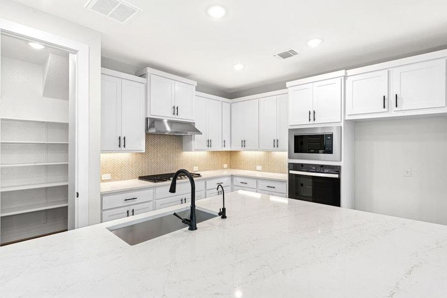 Furnished interior view inside a new home in University Heights, Round Rock (Image 6).