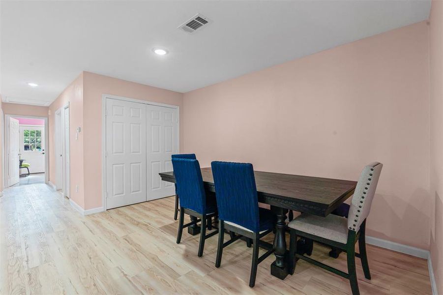 Dining space featuring light wood-style floors and recessed lighting Dining space featuring light wood-style floors and recessed lighting
