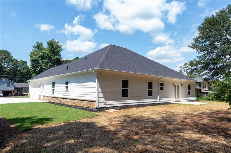 Front exterior of a new home in , Lithonia, GA, highlighting curb appeal (Image 16).