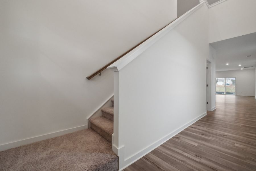 A room with a wood floor and white walls. A room with a wood floor and white walls.