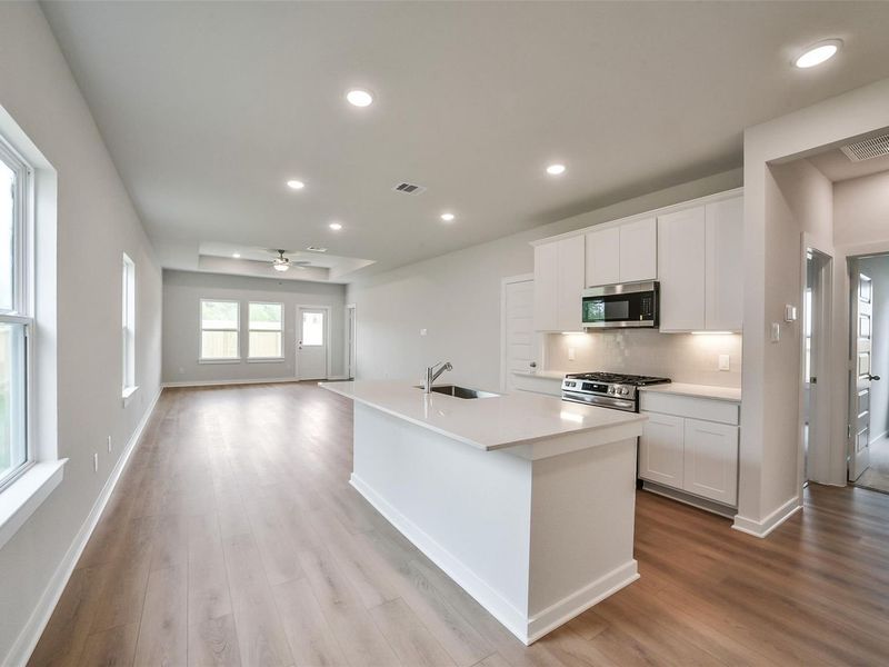 Furnished interior view inside a new home in Caney Creek Place, Conroe (Image 9).