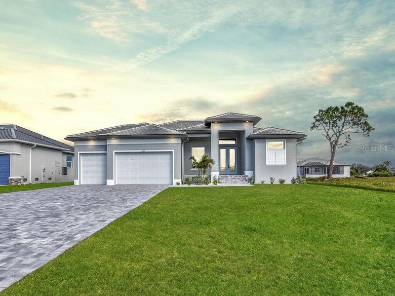Front exterior of a new home in , Rotonda West, FL, highlighting curb appeal (Image 1).