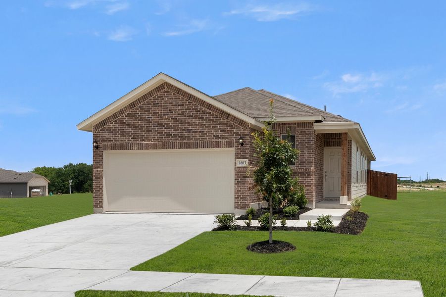 Front exterior of a new home in Creekside Ranch, Blue Ridge, TX, highlighting curb appeal (Image 2). Front exterior of a new home in Creekside Ranch, Blue Ridge, TX, highlighting curb appeal (Image 2).