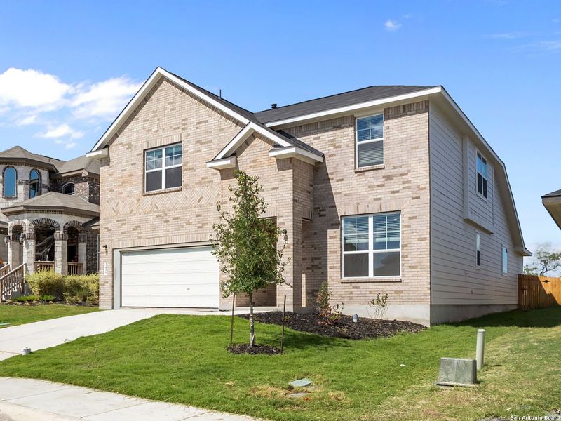 Front exterior of a new home in Horizon Pointe, Converse, TX, highlighting curb appeal (Image 22). Front exterior of a new home in Horizon Pointe, Converse, TX, highlighting curb appeal (Image 22).