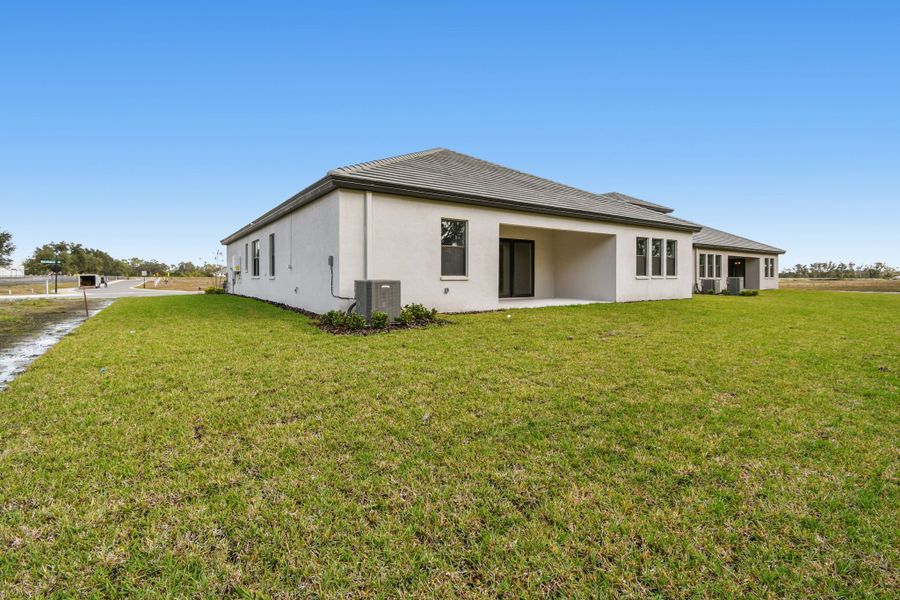 Exterior details and patio area of a home in River Preserve Estates, Parrish (Image 36).