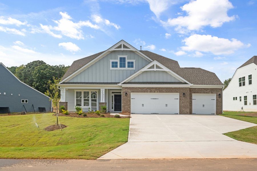 Front exterior of a new home in Grove Park, Clemmons, NC, highlighting curb appeal (Image 2). Front exterior of a new home in Grove Park, Clemmons, NC, highlighting curb appeal (Image 2).