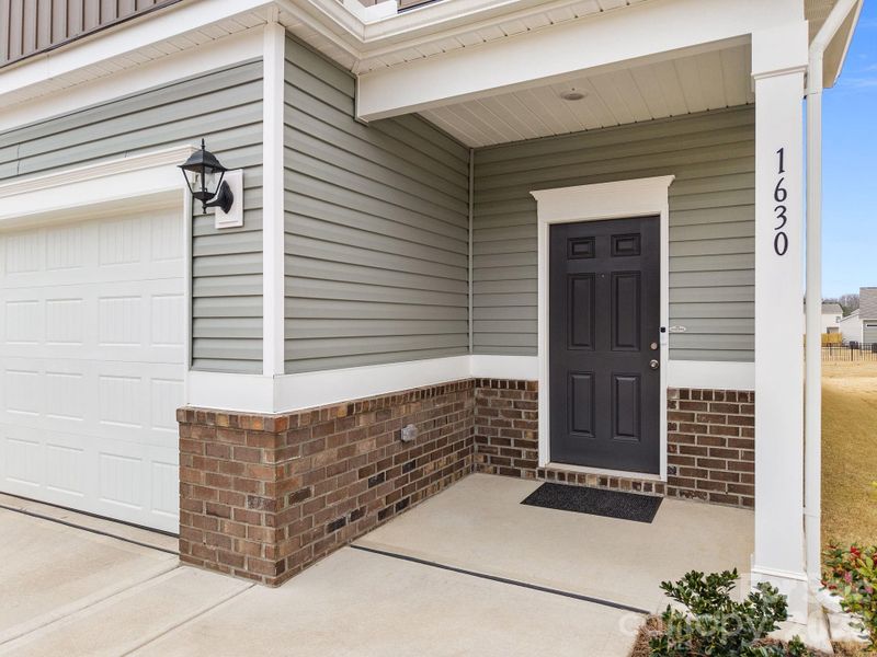 Exterior details and patio area of a home in Country Club Village, Salisbury (Image 22).