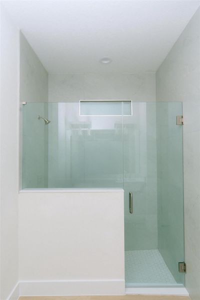 Primary Bathroom with a walk-in shower