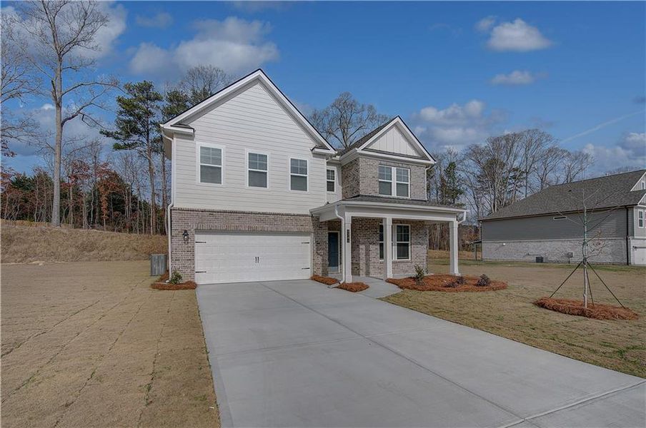 Front exterior of a new home in Hamilton Lakes, Lawrenceville, GA, highlighting curb appeal (Image 18). Front exterior of a new home in Hamilton Lakes, Lawrenceville, GA, highlighting curb appeal (Image 18).