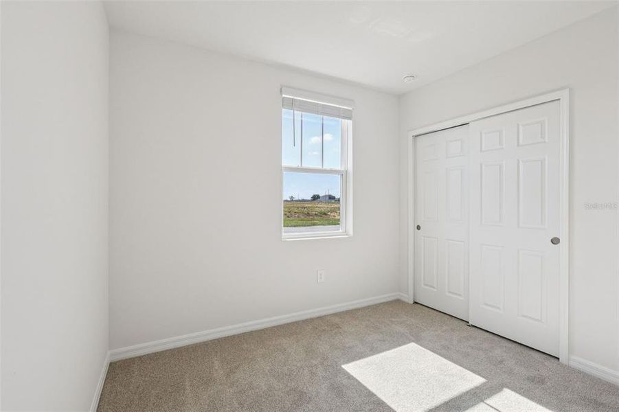 Spacious, unfurnished interior of a new home in Bradbury Creek - Signature Series, Haines City (Image 23).