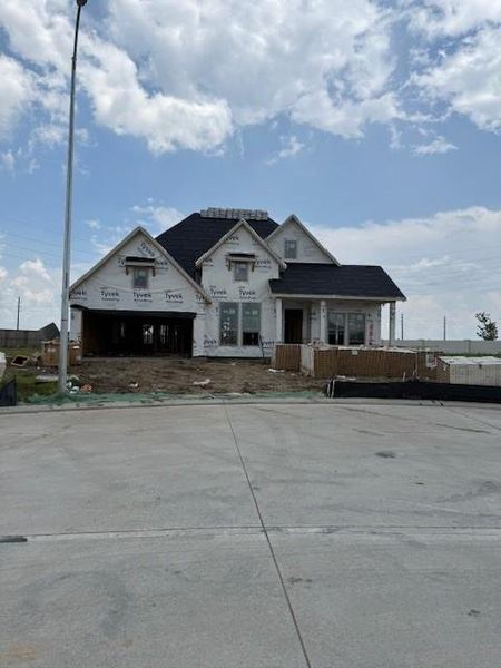 Front exterior of a new home in Valencia 60', Manvel, TX, highlighting curb appeal (Image 4).
