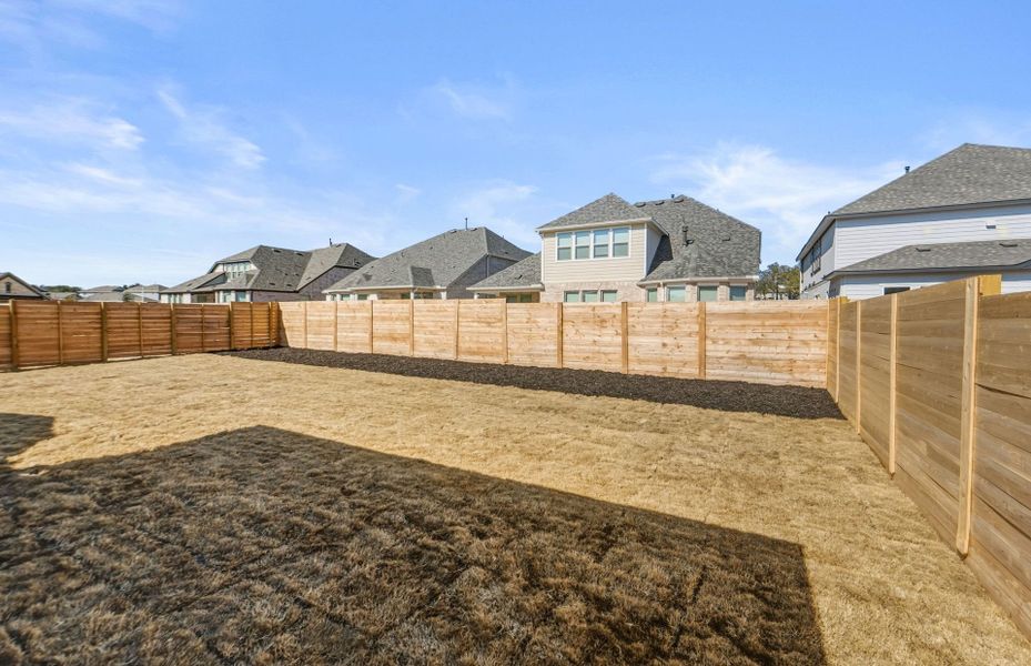 Exterior details and patio area of a home in Bluffview Reserve, Leander (Image 25).