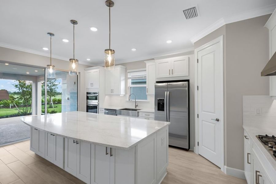 Furnished interior view inside a new home in Esplanade at Starling, Punta Gorda (Image 8).